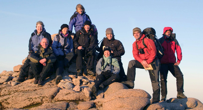 A group of climbers reach the summit